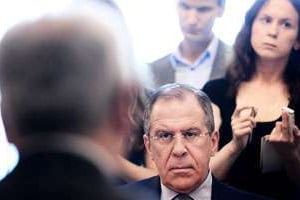 Sergueï Lavrov avec des émissaires du Conseil national syrien à Moscou, en 2012. © NATALIA KOLESNIKOVA/AFP