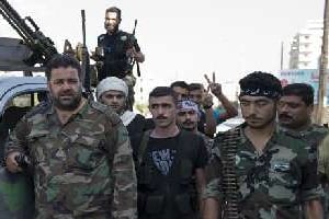 Des membres de la brigade Ahfad al-Rasul le 23 septembre 2012 à Alep. © AFP