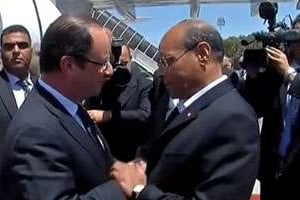 François Hollande (à g.) et Moncef Marzouki. © Capture d’écran YouTube/BFM TV