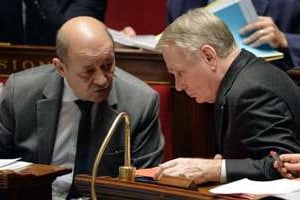 Jean-Yves Le Drian et Jean-Marc Ayrault le 18 février 2014 à l’Assemblée nationale à Paris. © Eric Feferberg/AFP