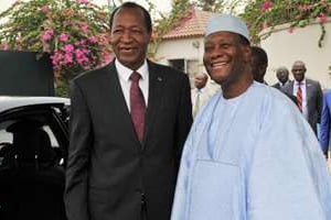Blaise Compaoré (à g.) et Alassane Ouattara. © AFP