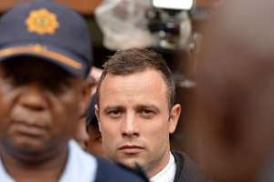 Oscar Pistorius quitte le tribunal, à Pretoria le 11 mars 2014. © AFP