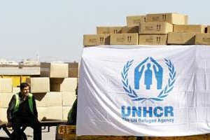 Des travailleurs de l’UNHCR à Damas le 13 février 2014. © AFP