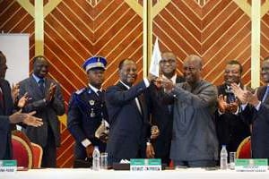 Alassane Ouattara et John Dramani Mahama à Yamoussoukro le 29 mars 2014. © AFP