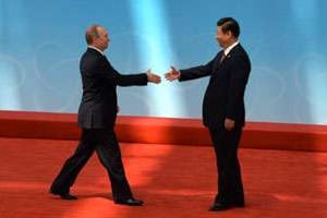 Vladimir Poutine et Xi Jinping à Shanghai, le 21 mai. © MARK RALSTON / AFP