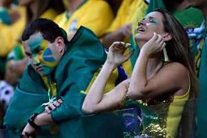 Des supporters brésiliens lors de la finale Brésil Allemagne le 8 juillet 2014 à Belo Horizonte. © AFP