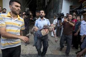Un enfant palestinien tué lors d’un raid israélien, le 20 juillet 2014 à Gaza. © AFP