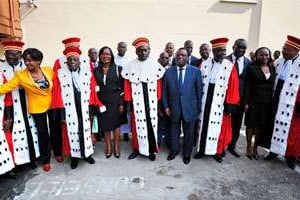 Membres de la Cour constitutionnelle et de la CEI, le 11 août à Abidjan. © Sia Kambou/AFP