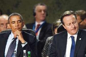 Barack Obama et David Cameron lors du sommet de l’Otan le 5 septembre. © AFP