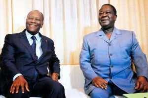 Henri K. Bédié (à d.) avec Alassane Ouattara, en novembre 2012, à Abidjan. © Sia Kambou (AFP)