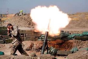 Tire de mortier contre des positions jihadistes, le 7 septembre au nord de Bagdad. © Stringer/Anadolu Agency