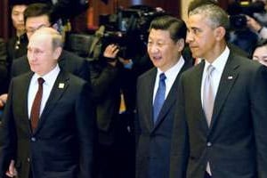 Vladimir Poutine, Xi Jinping et Barack Obama lors du sommet de l’Apec, le 10 novembre 2014 à Pékin © Pool for Yomiuri/Yomiuri/AFP