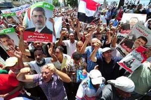 Des sympathisants de l’ex-président égyptien déchu Mohamed Morsi manifestent le 16 août 2013. © AFP