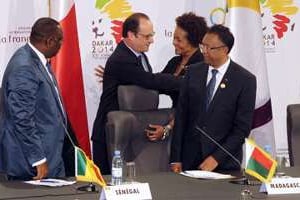 Michaëlle Jean entourée des présidents français, sénégalais et malgache le 30 novembre. © AFP
