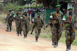 Des soldats rwandais de la MISCA patrouillent à proximité du camp Kasai dans Bangui, le 28 janvier 2014. © Issouf Sanogo/AFP