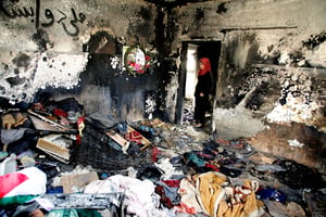 Le 30 juillet, l’incendie criminel d’une petite maison en Cisjordanie fait trois morts, dont un bébé, brûlé vif. © MAHMOUD ILLEAN/DEMOTIX/CORBIS