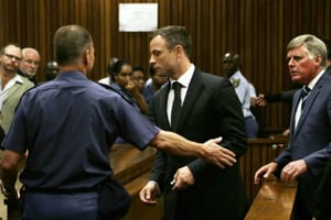 Le champion paralympique sud-africain Oscar Pistorius lors de son procès, le 21 octobre 2014 au tribunal de Pretoria. © Themba Hadebe/AFP
