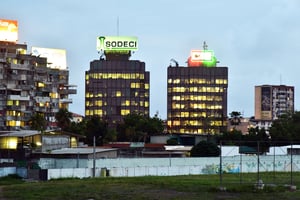 A photo taken in the Treichville suburb of Abidjan on May 3, 2016 shows the headquarters of Ivory Coast’s power firm Compagnie Ivoirienne d’Elecricite (CIE) and water company Societe de Distribution d’eau de Cote d’Ivoire (SODECI).Ivory Coast wants to end the monopoly of the companies which distribute electricity and water and liberalise these key sectors in the hopes of lowering prices, President Alassane Ouattara announced on May 1.  / AFP PHOTO / ISSOUF SANOGO © AFP