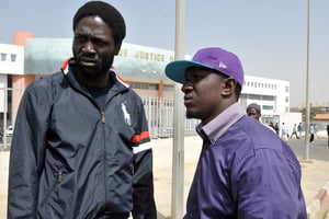 Kilifeu et Simon (à droite), leaders du mouvement Y’en a marre, à Dakar, le 22 février 2012. © SEYLLOU/AFP