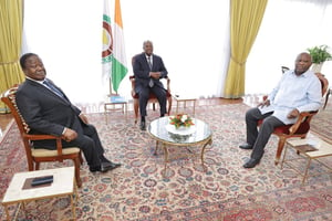  © De g. à dr. : Henri Konan Bédié, Alassane Ouattara et Laurent Gbagbo, à Abidjan, le 14 juillet 2022.