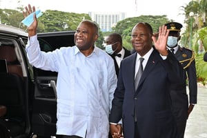 Alassane Ouattara (à dr.) et Laurent Gbagbo, à Abidjan, le 14 juillet 2022.  © Issouf Sanogo/AFP
