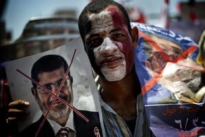 Manifestation contre le président Mohamed Morsi, sur la place Tahrir, au Caire, le 30 juin 2013. © Gianluigi Guercia/AFP