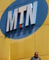 A man looks at his mobile at the end of a strike of MTN workers outside the company’s headquarters in Johannesburg May 20, 2015. About 2,000 workers at MTN Group went on strike on Wednesday demanding higher pay, union leaders said, threatening a prolonged walkout at South Africa’s second-biggest telecoms firm by subscribers. Zodwa Kubeka, spokeswoman for the Communication Workers Union (CWU), said its members at MTN want a 10 percent pay rise and higher allowances for work done over weekends and holidays. REUTERS/Siphiwe Sibeko – GF10000101389 © REUTERS